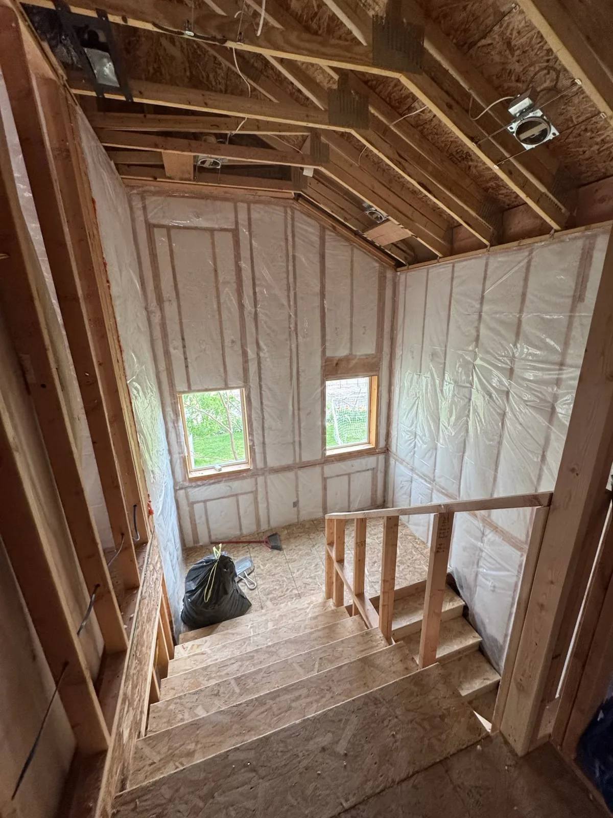 Open-framed stairwell with insulated exterior walls