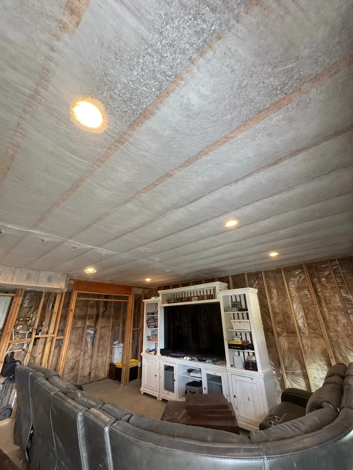 Insulated remodel room with furniture protected below the work area