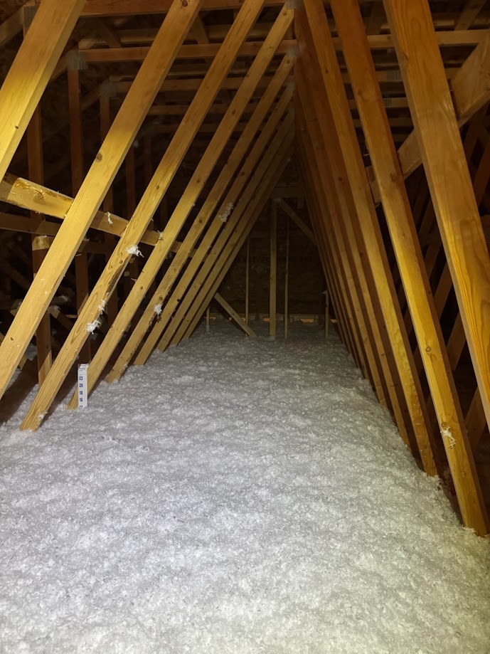 Loose-fill attic insulation across the floor of a Mapleton, Utah home